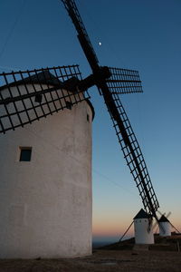 Low angle view of windmill against clear sky