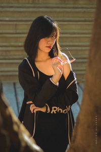 Midsection of a woman drinking glass