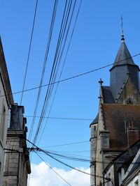 Low angle view of building against clear blue sky