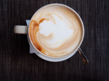 High angle view of cappuccino on table