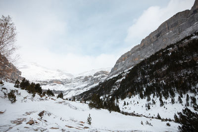 Scenic view of snow covered mountains against sky