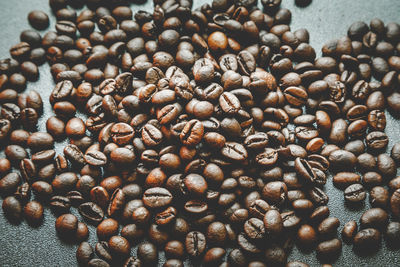 Roasted coffee beans on table