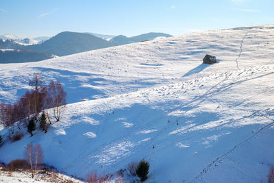 Sun over the winter mountains with snow, cindrel mountains, paltinis, romania