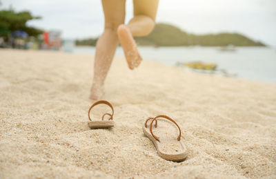 Low section of woman on beach