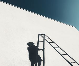 Low angle view of man standing on staircase