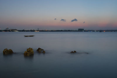 Scenic view of sea against sky at sunset