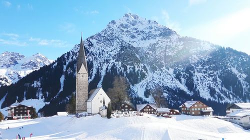 Panoramic view of snowcapped mountains against sky