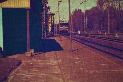 View of empty road with buildings in background