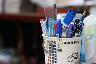 Close-up of pens in desk organizer