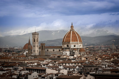 Cathedral in city against sky