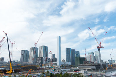 Modern buildings against sky in city