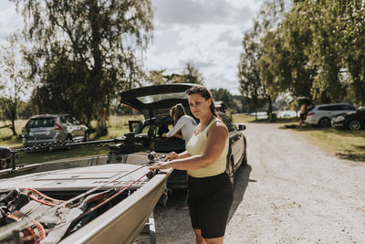 Woman standing near boat