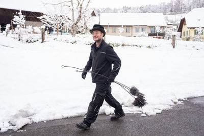Full length of man skiing on snow