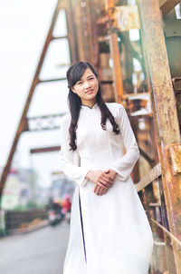 Young vietnamese girl wearing ao dai dress.