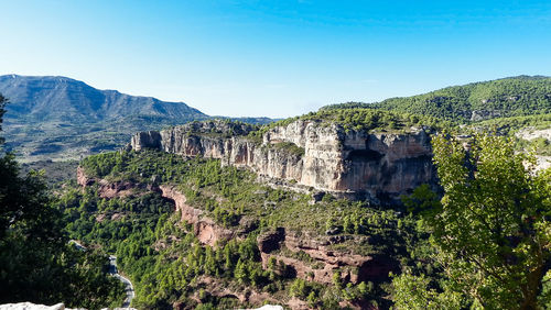 Scenic view of rocky mountains against clear sky