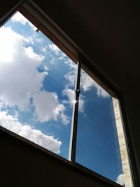 Low angle view of sky seen through window
