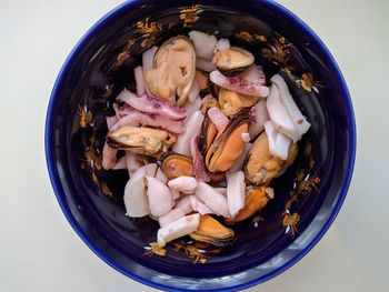 Mix of seafood in a bowl close up photo top view