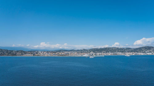 Scenic view of sea against blue sky