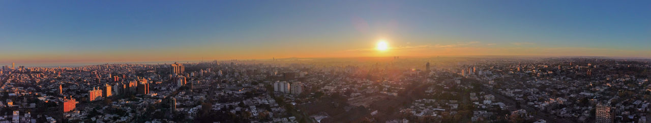 High angle view of city against sky during sunset