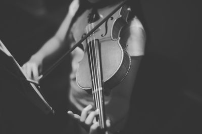 Close-up of person playing piano