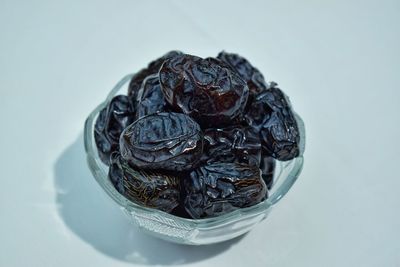 High angle view of fruit on table against white background