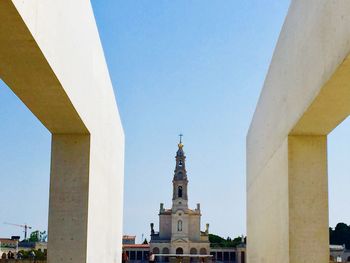 Low angle view of building against clear blue sky