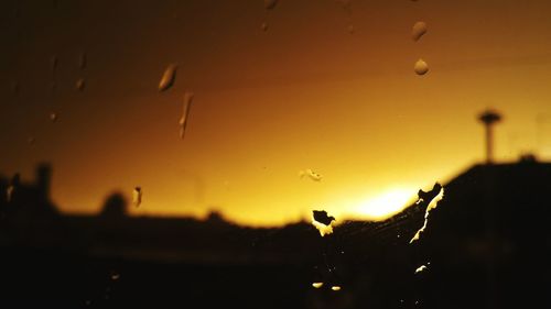 View of illuminated city at sunset