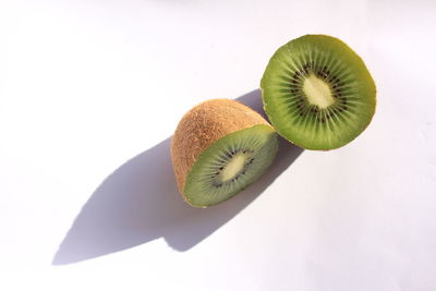 Close-up of fruits over white background