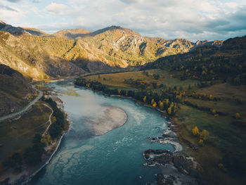 Aerial view of panoramic autumn mountain landscape with river. drone shot