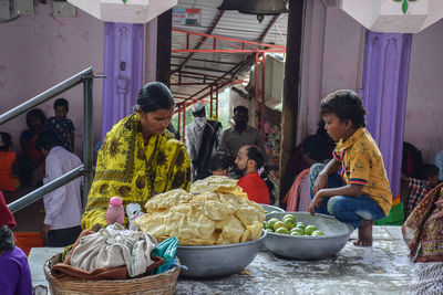 People at market stall