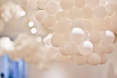 Close-up of white helium balloons