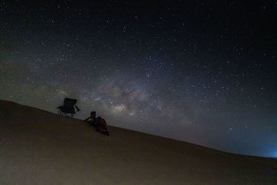 Low angle view of silhouette stars against sky at night