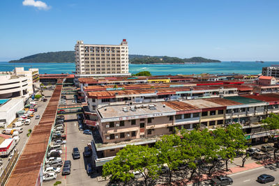 High angle view of buildings in city against sky