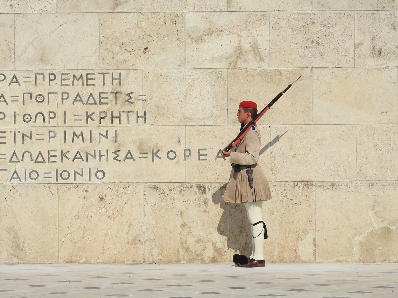 FULL LENGTH OF MAN STANDING ON WALL