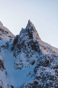 Scenic view of snowcapped mountains against clear sky