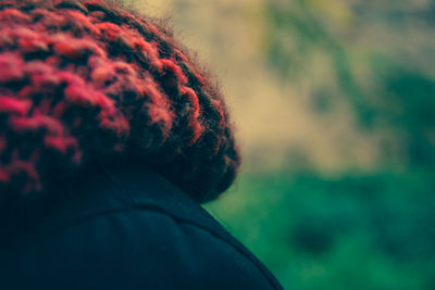 Close-up of person wearing knit hat outdoors