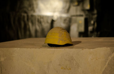 Close-up of yellow umbrella on table