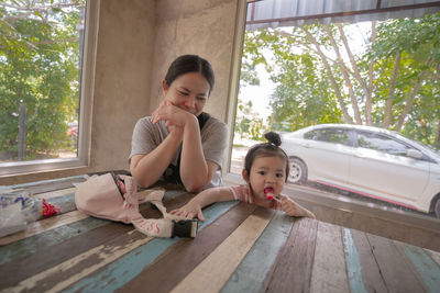 Mother and son on window