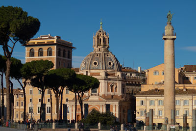 Trajan column, santa maria de loreto church in trajan's forum. rome, italy