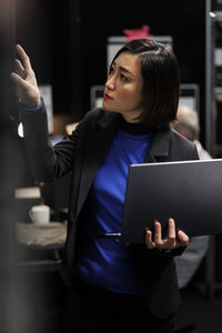 Young businesswoman using laptop