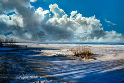 Scenic view of sea against sky during winter