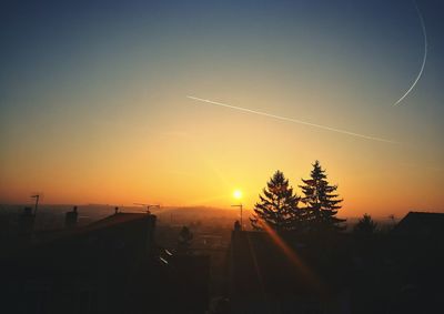 Scenic view of tree against sky during sunset