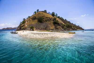 Little tropical island in pacific ocean turquoise water of komodo national park, indonesia