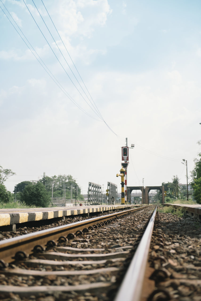 VIEW OF RAILROAD TRACK AGAINST SKY