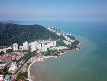 High angle view of townscape by sea