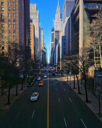 City street amidst buildings against sky