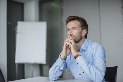 Portrait of pensive businessman in the office