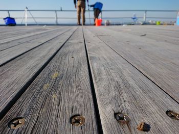 Low section of man on wooden pier