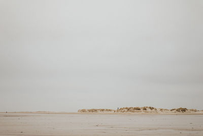 Scenic view of desert against clear sky