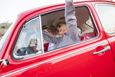 Senior couple sitting in car